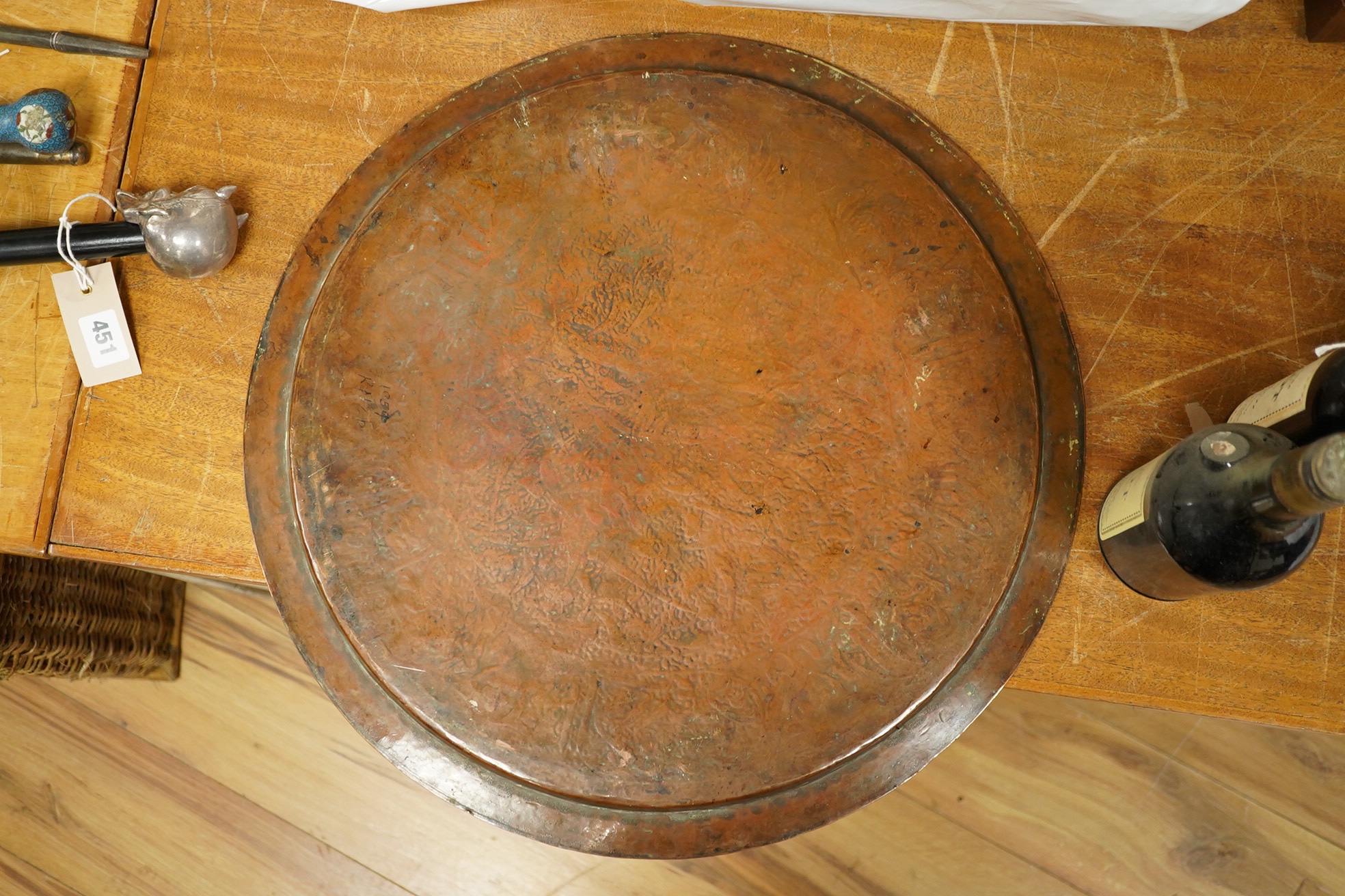 A Middle Eastern circular copper and niello damascened tray, 50cm in diameter. Condition - good